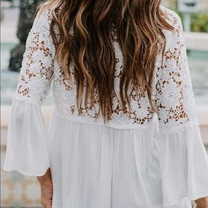 Lace cotton blouse . Button front v-neck.